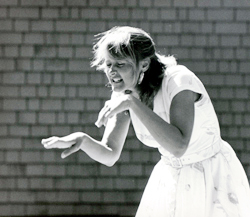 Susan Strauss pantomiming while telling the story of coyote digging 